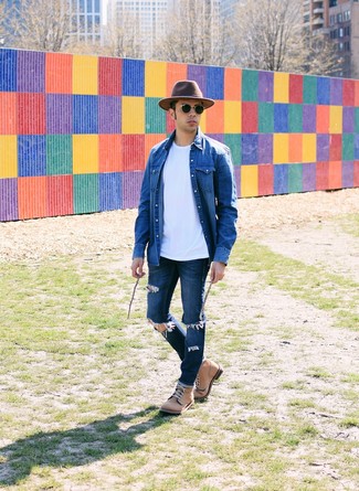 Dark Brown Wool Hat Outfits For Men: We all look for comfort when it comes to style, and this casual street style combo of a blue denim shirt and a dark brown wool hat is an amazing example of that. Serve a little mix-and-match magic by finishing with a pair of tan leather casual boots.