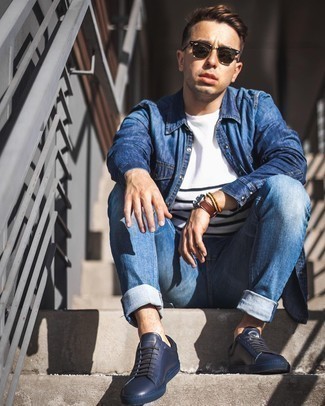 Navy Leather Low Top Sneakers Outfits For Men: Dress in a navy denim shirt and blue jeans for an effortless kind of elegance. Introduce a pair of navy leather low top sneakers to this outfit and the whole look will come together perfectly.
