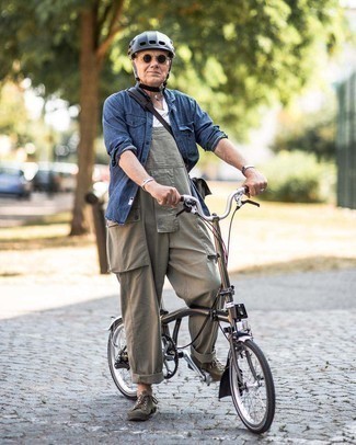 Olive Overalls Outfits For Men: If it's comfort and practicality that you appreciate in an outfit, wear a navy denim shirt with olive overalls. Complement this ensemble with a pair of olive canvas low top sneakers to tie the whole outfit together.