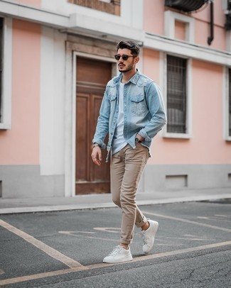 Light Blue Denim Shirt Outfits For Men: A light blue denim shirt and khaki skinny jeans are a cool look worth incorporating into your off-duty fashion mix. White leather low top sneakers work amazingly well here.