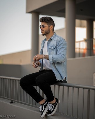 Aquamarine Denim Shirt Outfits For Men: An aquamarine denim shirt and black skinny jeans are a great combination to have in your day-to-day casual routine. A nice pair of black and white canvas low top sneakers ties this look together.
