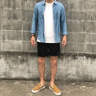 Beige Canvas Slip-on Sneakers Outfits For Men: A light blue denim shirt and black sports shorts are totally worth being on your list of must-have casual styles. Clueless about how to round off this ensemble? Rock beige canvas slip-on sneakers to class it up.