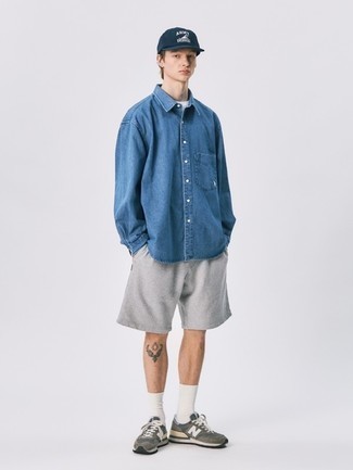 Blue Denim Shirt Outfits For Men: If you like city casual style, why not try pairing a blue denim shirt with grey sports shorts? The whole look comes together brilliantly if you complete your ensemble with a pair of charcoal athletic shoes.