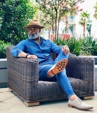 Beige Straw Hat Outfits For Men: Who said you can't make a fashionable statement with a city casual look? That's easy in a blue denim shirt and a beige straw hat. To give your look a smarter touch, complement this outfit with a pair of grey canvas derby shoes.