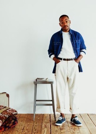 Men's Outfits 2022: Choose a navy denim shirt and white jeans to put together a casually stylish look. A pair of navy and white canvas low top sneakers is a surefire footwear option here that's full of personality.