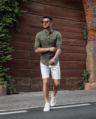 Silver Watch Casual Outfits For Men: Rock an olive denim shirt with a silver watch for a stylish and city casual outfit. Why not complement your look with white canvas low top sneakers for a sense of refinement?