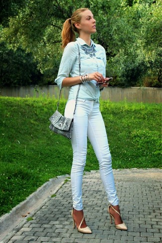 Light Blue Denim Shirt Outfits For Women: If you're looking for a relaxed and at the same time seriously chic outfit, wear a light blue denim shirt and white skinny pants. Tan leather pumps integrate well within a great deal of combos.