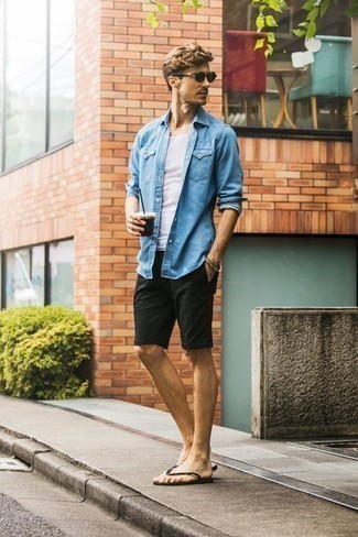 Navy Denim Shirt Outfits For Men: Such staples as a navy denim shirt and black shorts are an easy way to infuse effortless cool into your casual fashion mix. A pair of black flip flops immediately steps up the fashion factor of this look.