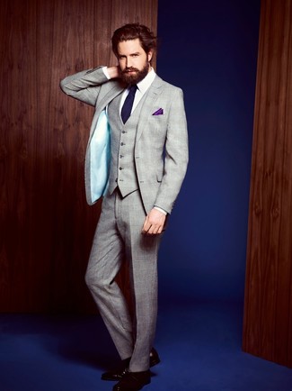 Jack Guinness wearing Navy Vertical Striped Tie, Burgundy Leather Derby Shoes, White Dress Shirt, Grey Plaid Three Piece Suit
