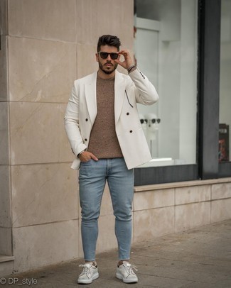 White Double Breasted Blazer Outfits For Men: Putting together a white double breasted blazer and light blue skinny jeans is a fail-safe way to inject a polished touch into your closet. Finishing with a pair of grey leather low top sneakers is the most effective way to inject a more laid-back vibe into your look.