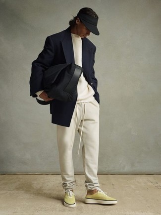 Navy Double Breasted Blazer Outfits For Men: Go for an effortlessly stylish menswear style in a navy double breasted blazer and beige sweatpants. To bring an element of stylish casualness to your outfit, complete this outfit with green-yellow canvas low top sneakers.
