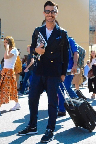 Black Suitcase Outfits For Men: If you gravitate towards casual style, why not take this combo of a navy double breasted blazer and a black suitcase for a spin? To give this getup a more casual touch, why not grab a pair of black athletic shoes?