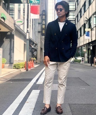 Blue Vertical Striped Blazer Outfits For Men: The formula for effortlessly neat menswear style? A blue vertical striped blazer with beige chinos. You know how to inject an extra dose of style into this look: dark brown leather monks.