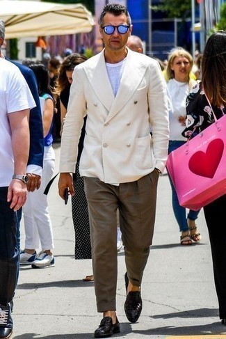 Beige Double Breasted Blazer Outfits For Men: Dress in a beige double breasted blazer and brown dress pants and you will definitely make ladies go weak in the knees. Dark brown woven leather tassel loafers will effortlessly tone down an all-too-polished ensemble.