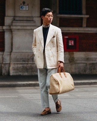 Tan Canvas Duffle Bag Outfits For Men: For something on the off-duty side, opt for a beige double breasted blazer and a tan canvas duffle bag. Got bored with this look? Enter brown suede loafers to spice things up.