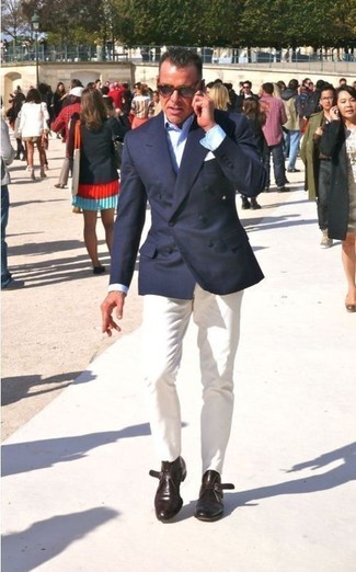 George Cortina wearing Navy Double Breasted Blazer, Light Blue Dress Shirt, White Chinos, Dark Brown Leather Monks