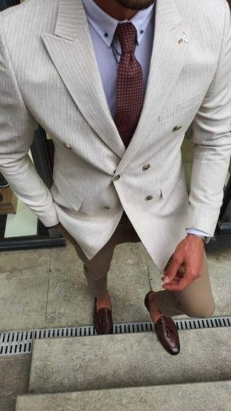 Beige Vertical Striped Double Breasted Blazer Outfits For Men: A beige vertical striped double breasted blazer and khaki chinos are surely worth being on your list of indispensable menswear items. If you feel like stepping it up, introduce burgundy leather tassel loafers to the mix.