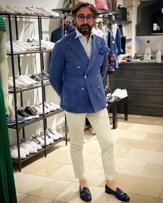 Blue Vertical Striped Blazer Outfits For Men: This combination of a blue vertical striped blazer and white chinos makes for the perfect base for an outfit. Give an elegant twist to an otherwise everyday look by wearing navy leather double monks.