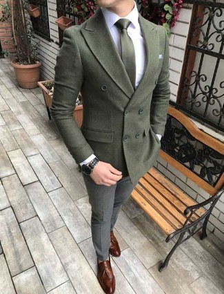 Dark Green Wool Double Breasted Blazer Outfits For Men: Go for a dark green wool double breasted blazer and grey wool dress pants and you'll be the picture of refinement. Finish with brown leather tassel loafers to keep the look fresh.