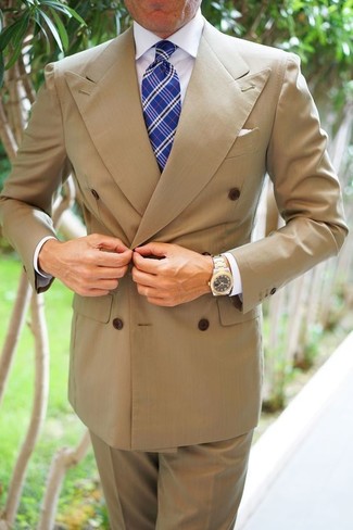 Blue Plaid Tie Outfits For Men: You're looking at the hard proof that a tan double breasted blazer and a blue plaid tie are amazing when combined together in a polished ensemble for a modern man.