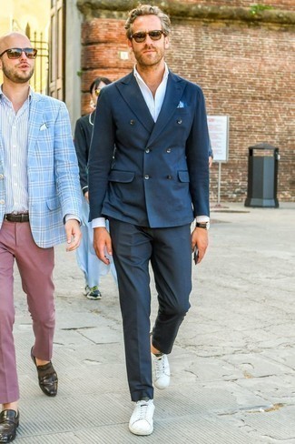 White Leather Low Top Sneakers Dressy Outfits For Men: To look like a sharp gentleman at all times, pair a navy double breasted blazer with navy dress pants. For a more casual twist, why not introduce white leather low top sneakers to the equation?