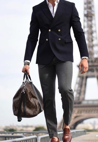 Brown Leather Loafers Outfits For Men: Try teaming a navy double breasted blazer with charcoal dress pants for a really stylish look. To give your overall look a more laid-back feel, introduce a pair of brown leather loafers to the equation.