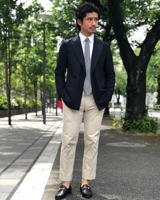 White and Navy Tie Outfits For Men: Try pairing a navy double breasted blazer with a white and navy tie for a really classic getup. Finishing with black leather loafers is a surefire way to inject a more casual aesthetic into this getup.