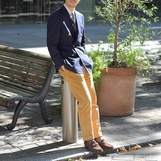Yellow Corduroy Dress Pants Outfits For Men: For a look that's refined and absolutely camera-worthy, marry a navy double breasted blazer with yellow corduroy dress pants. Finishing with brown suede loafers is a guaranteed way to inject a hint of stylish nonchalance into your outfit.