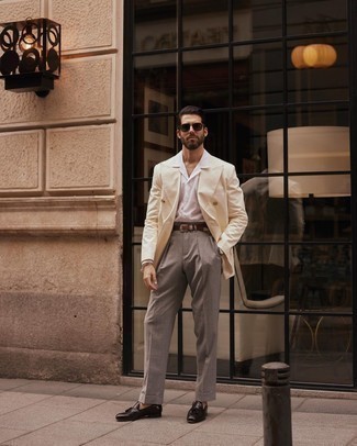 Beige Double Breasted Blazer Outfits For Men: This sophisticated combination of a beige double breasted blazer and grey dress pants will prove your styling expertise. If you need to instantly dress down your look with one piece, add a pair of dark brown leather tassel loafers to the mix.