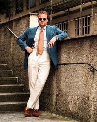 Teal Double Breasted Blazer Outfits For Men: Combining a teal double breasted blazer and beige dress pants is a surefire way to breathe style into your current lineup. Go the extra mile and switch up your outfit by wearing a pair of brown suede tassel loafers.