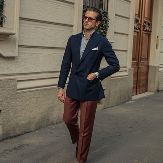 Brown Sunglasses Outfits For Men: To achieve a casual look with a twist, try teaming a navy double breasted blazer with brown sunglasses. Dark brown suede tassel loafers will bring a dressier twist to this getup.