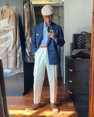 Men's Outfits 2021: For a look that's sophisticated and totally GQ-worthy, consider pairing a navy double breasted blazer with white dress pants. To give your outfit a more laid-back vibe, complement this ensemble with a pair of brown leather boat shoes.