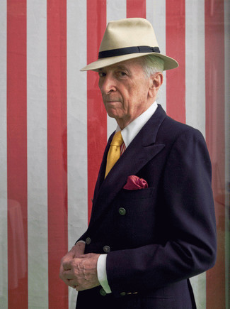 Gay Talese wearing Navy Double Breasted Blazer, Red Vertical Striped Dress Shirt, Beige Wool Hat, Yellow Tie