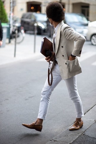 Beige Double Breasted Blazer Outfits For Men: A beige double breasted blazer and white jeans are powerful sartorial weapons in any modern gent's closet. To bring out a classy side of you, introduce a pair of brown leather loafers to this ensemble.