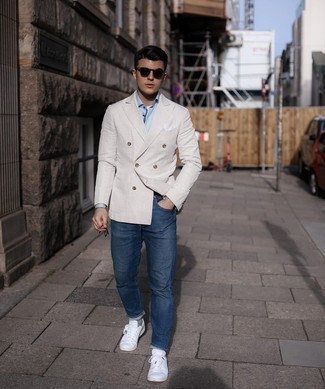 Men's Beige Double Breasted Blazer, White and Blue Vertical Striped Dress Shirt, Navy Jeans, White Canvas Low Top Sneakers