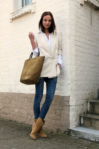 Beige Suede Ankle Boots Outfits: This combination of a beige double breasted blazer and navy skinny jeans is hard proof that a straightforward casual outfit doesn't have to be boring. A pair of beige suede ankle boots effortlessly ups the oomph factor of any outfit.