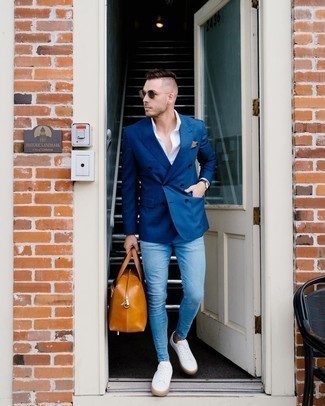 Tobacco Leather Holdall Outfits For Men: This casual combination of a navy double breasted blazer and a tobacco leather holdall is capable of taking on different nuances depending on how you style it out. As for footwear, introduce white canvas low top sneakers to this look.