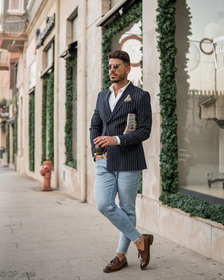 Blue Vertical Striped Blazer Outfits For Men: Nail the cool and relaxed ensemble by opting for a blue vertical striped blazer and light blue skinny jeans. And if you want to immediately dress up your getup with one single item, why not complete your look with dark brown leather tassel loafers?