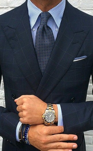 This sophisticated combo of a navy check double breasted blazer and a white and blue vertical striped dress shirt is a popular choice among the sartorially superior gents.