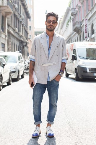 Men's Grey Linen Double Breasted Blazer, Light Blue Long Sleeve Shirt, Blue Jeans, White and Blue Leather Derby Shoes