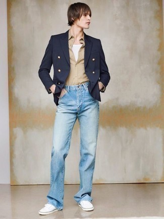 Navy Double Breasted Blazer Outfits For Men: For an effortlessly smart outfit, wear a navy double breasted blazer with light blue jeans — these two pieces play nicely together. Complete your ensemble with white canvas low top sneakers to inject a dash of stylish nonchalance into your outfit.