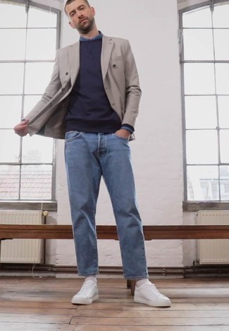 Grey Double Breasted Blazer Outfits For Men: For an outfit that's nothing less than envy-worthy, reach for a grey double breasted blazer and light blue jeans. Complete this ensemble with white canvas low top sneakers to keep the ensemble fresh.