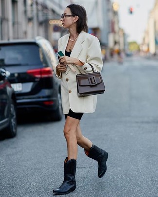 Bike Shorts Outfits: This casual combo of a white double breasted blazer and bike shorts is super easy to throw together without a second thought, helping you look chic and prepared for anything without spending too much time searching through your wardrobe. Let your styling prowess truly shine by completing your ensemble with black leather cowboy boots.