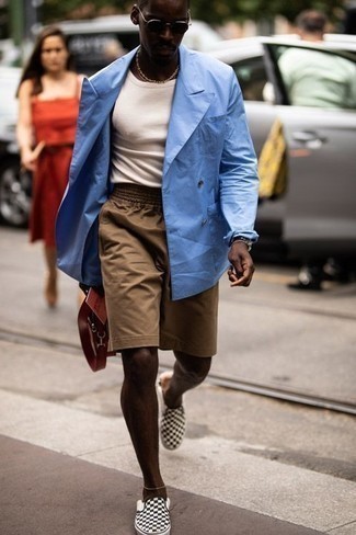 Black Slip-on Sneakers Outfits For Men: Marrying a light blue double breasted blazer and tan shorts is a surefire way to infuse your wardrobe with some manly elegance. To add a more casual feel to this outfit, complete this look with black slip-on sneakers.