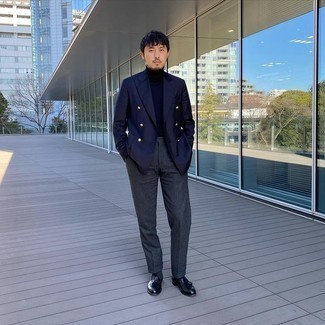 Black Leather Tassel Loafers Outfits: This combo of a navy double breasted blazer and charcoal dress pants couldn't possibly come across as anything other than ridiculously dapper and classy. Dial down the formality of this look by rounding off with black leather tassel loafers.