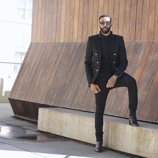 Black Double Breasted Blazer Outfits For Men: Perfect the casually neat look by wearing a black double breasted blazer and black jeans. If you wish to instantly perk up this outfit with one single item, add a pair of black leather chelsea boots to this look.
