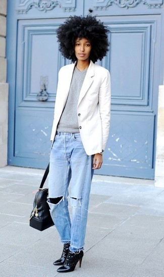White Blazer Outfits For Women: A white blazer and light blue ripped boyfriend jeans are great items to incorporate into your casual fashion mix. To introduce a little zing to your ensemble, introduce black lace ankle boots to the equation.