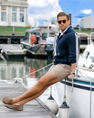 Driving Shoes Outfits For Men: This casual combination of a navy double breasted cardigan and tan shorts is extremely easy to throw together in no time flat, helping you look seriously stylish and ready for anything without spending a ton of time searching through your closet. If you're clueless about how to round off, introduce a pair of driving shoes to the equation.