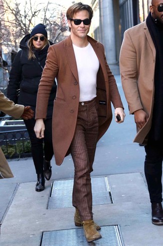 Chris Pine wearing Olive Suede Chelsea Boots, Brown Vertical Striped Dress Pants, White Crew-neck T-shirt, Brown Overcoat