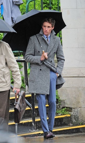 Eddie Redmayne wearing Dark Brown Leather Oxford Shoes, Blue Dress Pants, Light Blue Dress Shirt, Grey Herringbone Overcoat